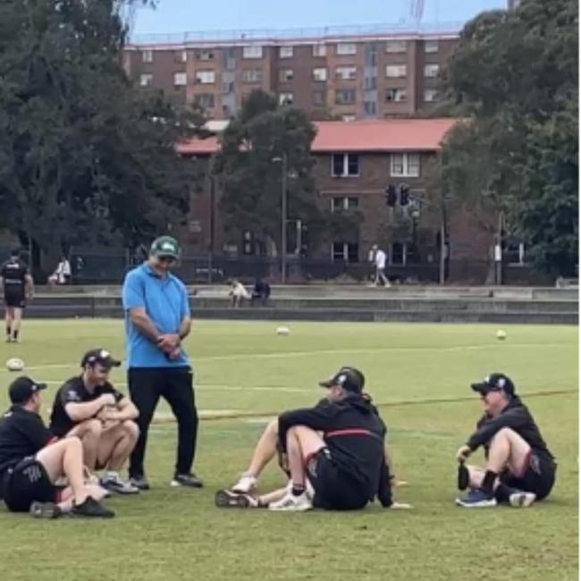 Mario Fenech talks to Rabbitohs players at training on Tuesday.