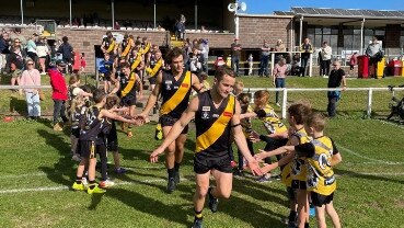 Portland captain Daniel Jackson leads his team onto the ground for the match against North Warrnambool on Saturday.