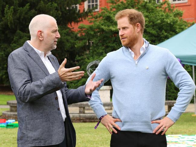 Prince Harry speaks to Colin Dyer, CEO of WellChild, at the awards where he was a special guest star.