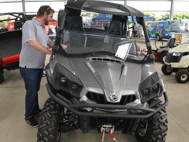 Ryan McLean of Mackay checks out a Can-Am Commander  SSV at the Mackay Ag Show at the JG Centre exhibit. The vehicle can be used for recreation or on the farm.Photo Peter Holt / Daily Mercury