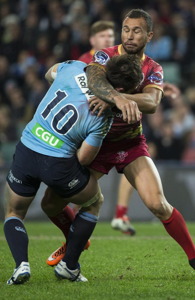 Quade Cooper crunches Bernard Foley. Picture: Mitch Cameron