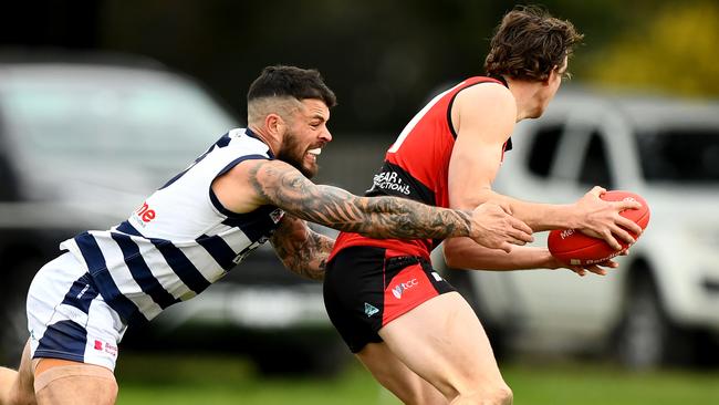 Jaxson Kinnear is tackled by Hamish Govan. Picture: Josh Chadwick