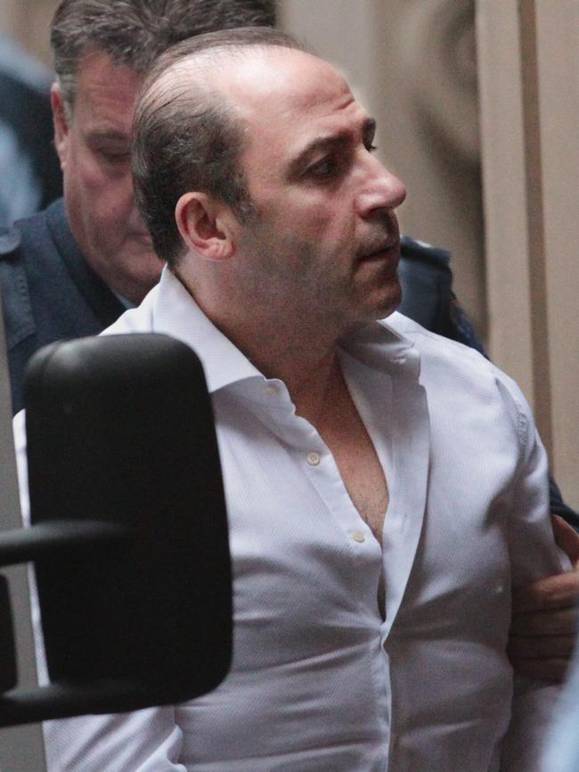 Tony Mokbel being lead into a prison van in 2011. Picture: Supplied