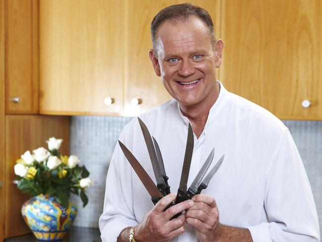 Tim Shaw in his kitchen with knives, today. Picture: David Hahn.