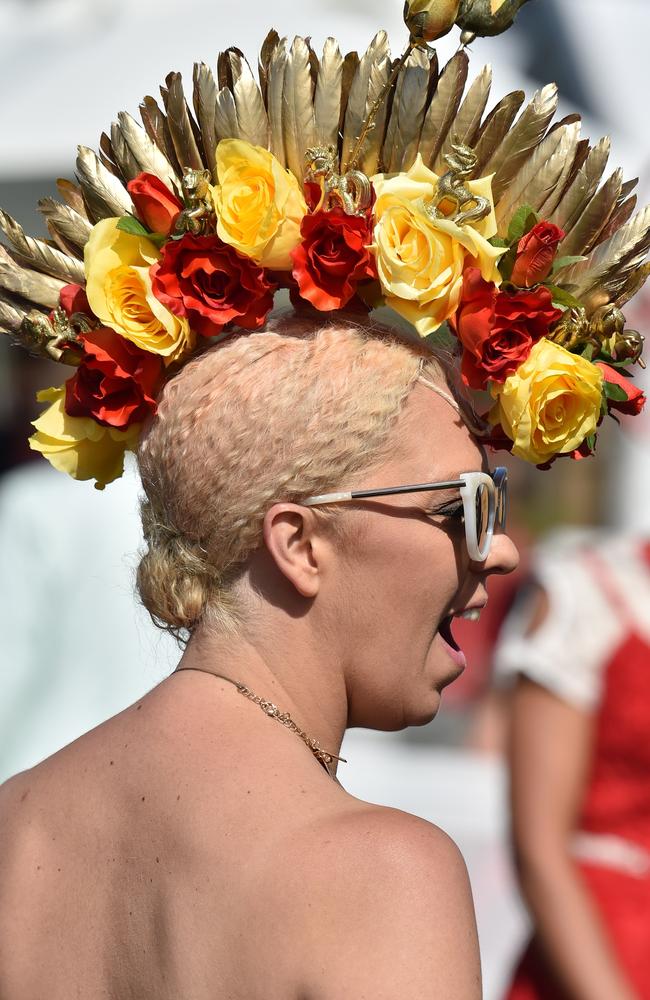 A racegoer prepares for the annual Fashion on the Field competition at Flemington Racecourse on Melbourne Cup day in Melbourne on November 3, 2015. Picture: AFP PHOTO/Paul CROCK