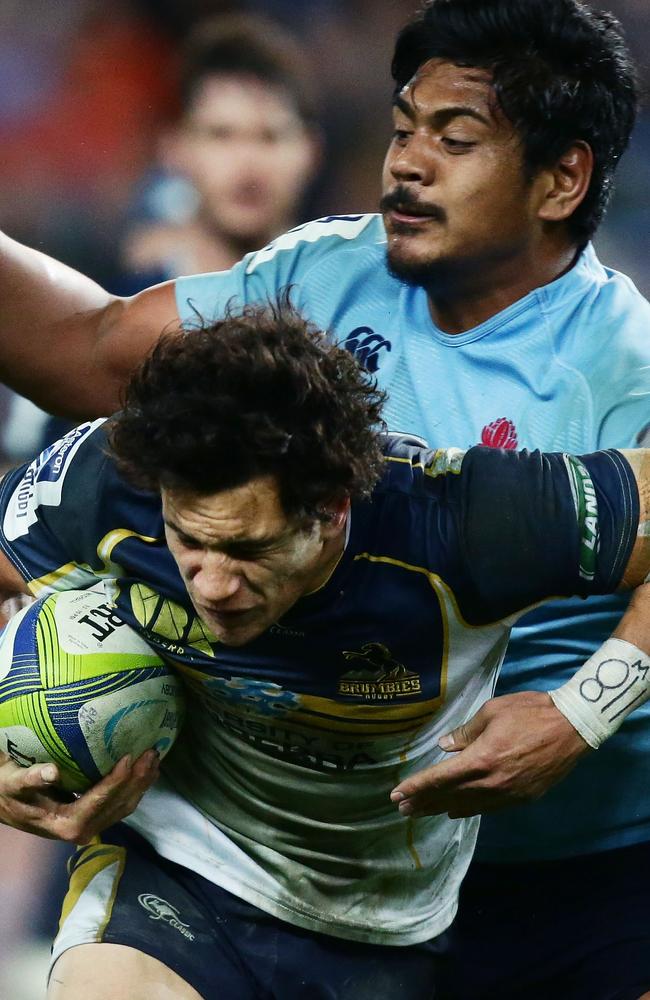 Brumbies flyhalf Matt Toomua is tackled by Will Skelton.