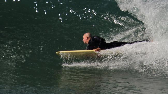 Para Surfer Joel Taylor in the water at Lennox Head. Photo: Danny Mortison