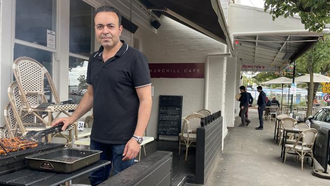 Churchill Cafe's Hamid Nasirzadeh says he has lost more than 20 per cent of his usual takings since level crossing removal works began in Mont Albert. Picture: Kiel Egging.