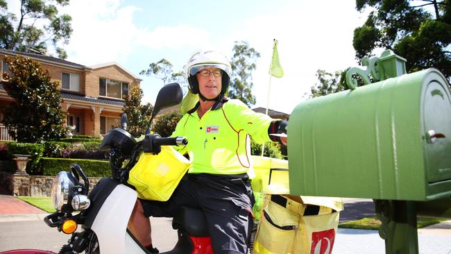 Stephen Goulder delivers the post in Sydney’s West Pennant Hills. Picture AAP