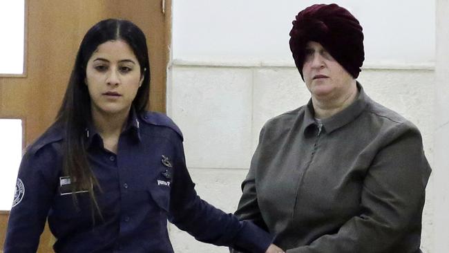 Australian Malka Leifer, right, is brought to a courtroom in Jerusalem. An Israeli psychiatric panel has determined that Leifer facing dozens of sex-abuse charges in Australia is fit to stand trial for extradition, the Justice Ministry confirmed.