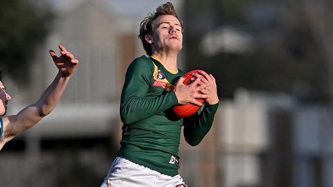 Bradley Johnstone marks for Old Eltham Collegians. Picture: Andy Brownbill