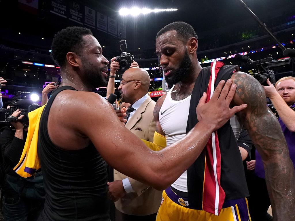 LeBron James, Dwyane Wade hug, swap jerseys in final meeting as Lakers win  vs. Heat