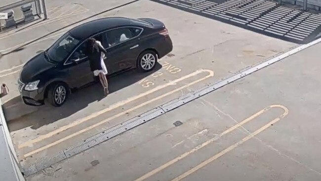 CCTV footage shows the woman talking to her partner while holding Princess. Picture: Supplied