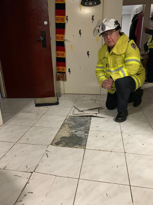 NSW Fire Rescue inside a damaged unit.