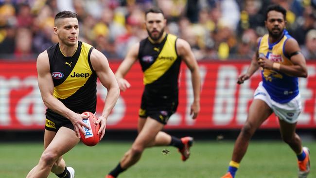 Dion Prestia powers away from congestion against West Coast. Picture: AAP Image/Michael Dodge.