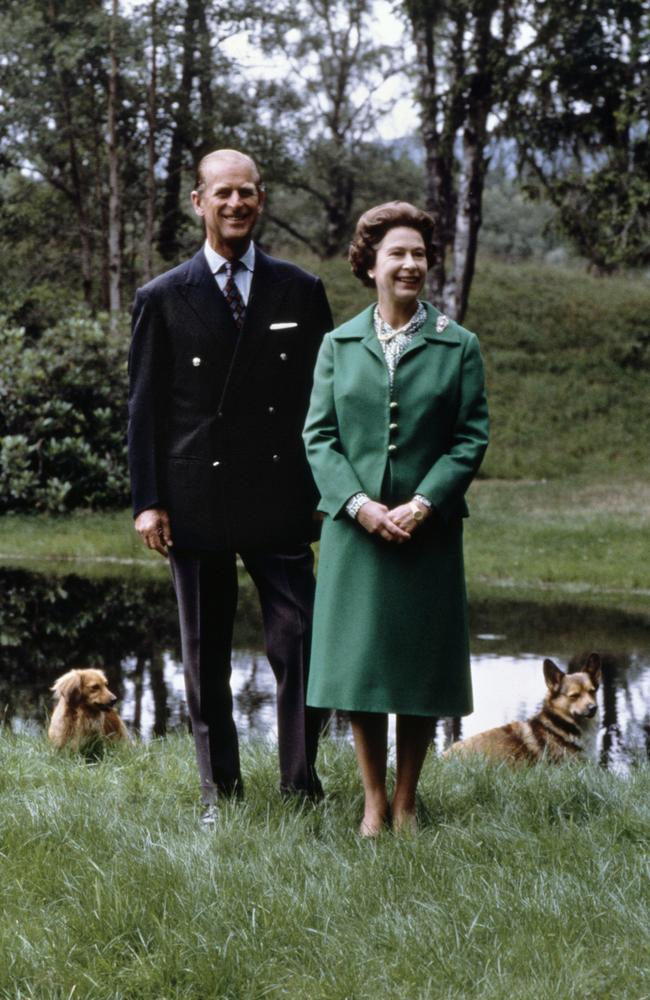 Queen Elizabeth II and Prince Philip pose with the royal corgies for their 32nd wedding anniversary in Balmoral Castle, Scotland, in 1979. Picture: AFP