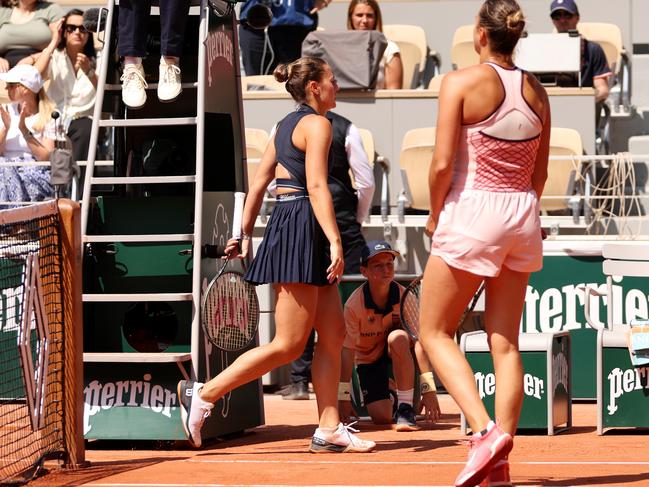 PARIS, FRANCE - MAY 28: Marta Kostyuk of Ukraine walks past Aryna Sabalenka after their Women's Singles First Round Match on Day One of the at Roland Garros on May 28, 2023 in Paris, France. (Photo by Clive Brunskill/Getty Images)