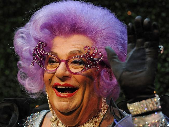 (FILES) In this file photo taken on July 5, 2012, Australian comedian, actor and author Australian Barry Humphries, dressed as his alter ego, Dame Edna Everage, appeares at a press conference in Sydney. - Humphries died on April 22, 2023 in a Sydney hospital, prompting a tribute from the prime minister who described him as "the brightest star". (Photo by Greg WOOD / POOL / AFP)