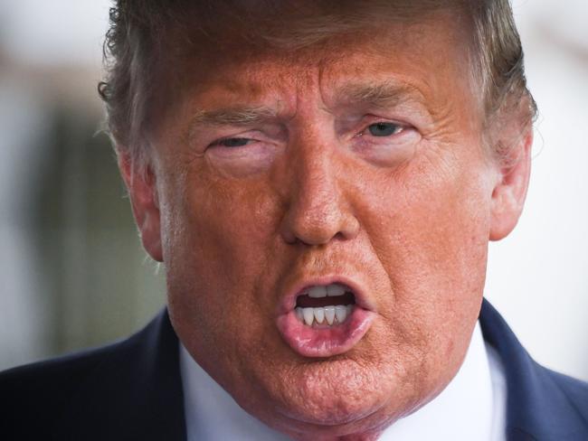 (FILES) In this file photo US President Donald Trump speaks to the press before departing the White House  on June 20, 2020 in Washington, DC, for a campaign rally in Tulsa, Oklahoma. - One of Donald Trump's brothers requested a restraining order to block publication of a potentially explosive book written by the US president's niece, The New York Times reported June 23, 2020. Mary Trump will release her no-holds-barred memoir "Too Much and Never Enough: How My Family Created the World's Most Dangerous Man," on July 28, according to publishing house Simon & Schuster. (Photo by Eric BARADAT / AFP)