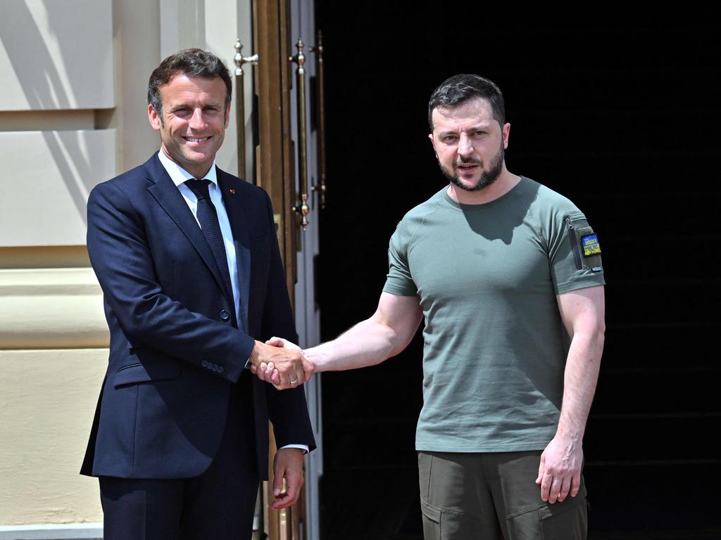 Ukrainian President Volodymyr Zelenskyy shakes hands with French President Emmanuel Macron ahead of a meeting in Kyiv. Picture: AFP