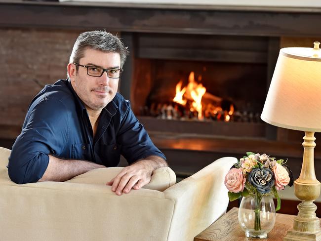 MANLY DAILY/AAP. Author John Purcell poses during a photo shoot in his home at Davidson on Friday, May 31. Author John Purcell writes mostly erotic fiction for women under a female pseudonym, in the style of Fifty Shades of Grey. He is selling his Davidson home to move overseas so he can concentrate on his writing. AAP IMAGE / Troy Snook)