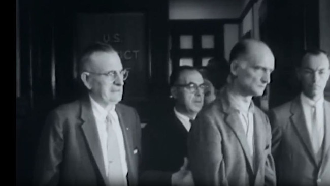 Rudolf Abel, second from right, arriving at court in 1957. The image is still from a Gaumont British newsreel via Reuters