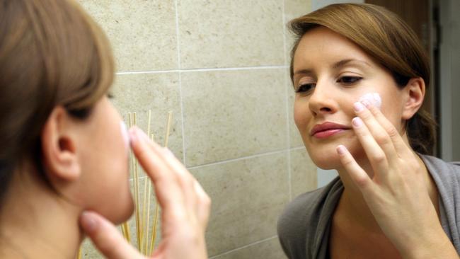 22/05/2009 BUSINESS: Laura Eckstein applies moisturiser on her face as she tries out a few 'anti-ageing' face creams, in Sydney. Most of these cosmeceuticals do not live up to their claims.