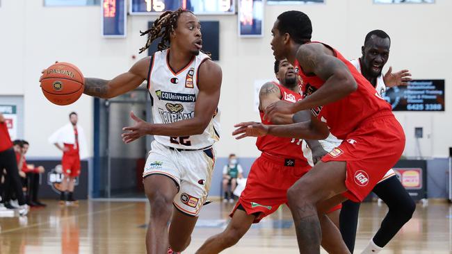 Tahjere McCall of the Cairns Taipans protects the ball against Victor Law of the Perth Wildcats (Photo by Sarah Reed/Getty Images)