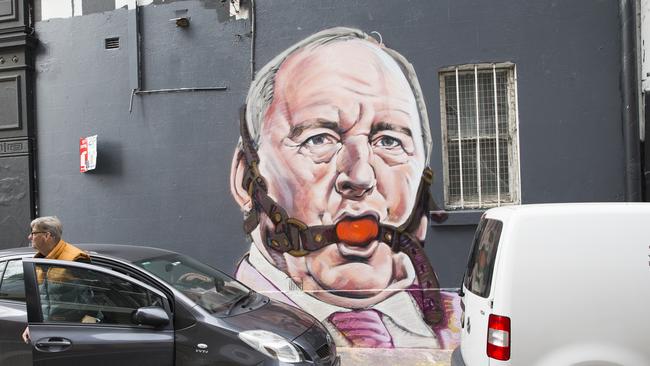 A mural of Alan Jones with a ball gag in his mouth has been painted on a building in Chippendale by Scott Marsh. Picture: Dylan Robinson