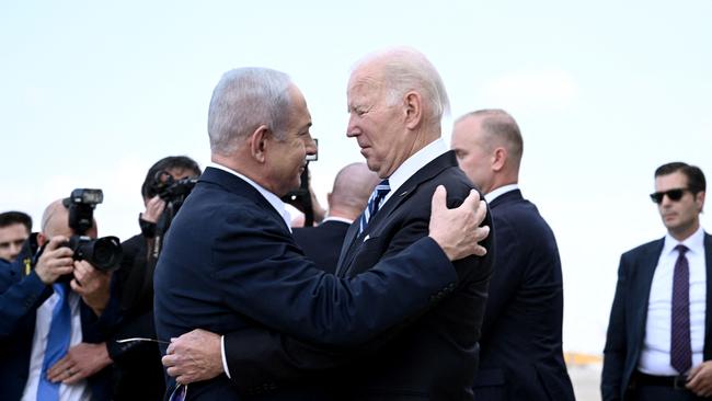 Israel Prime Minister Benjamin Netanyahu greets US President Joe Biden upon his arrival at Tel Aviv's Ben Gurion airport.