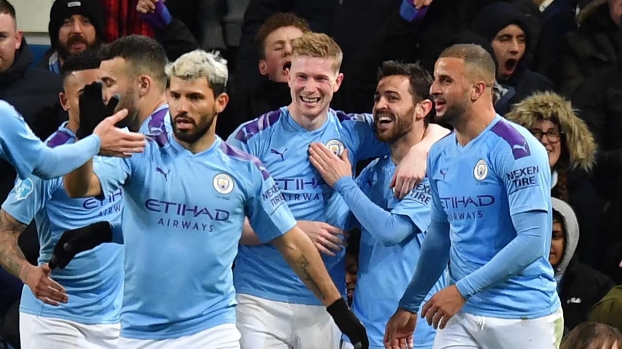 Manchester City's Belgian midfielder Kevin De Bruyne celebrates with teammates after scoring their second goal.