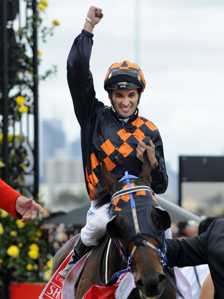 03/11/2009 WIRE: 03/11/2009 WIRE: Shocking with jockey Corey Brown celebrates after winning the Melbourne Cup horse race at Flemington Racecourse, in Melbourne, Australia, Tuesday, Nov. 3, 2009. Crime Scene came in second with Mourilyan third. ( AP Photo/Andrew Brownbill) F8322473 F8322473