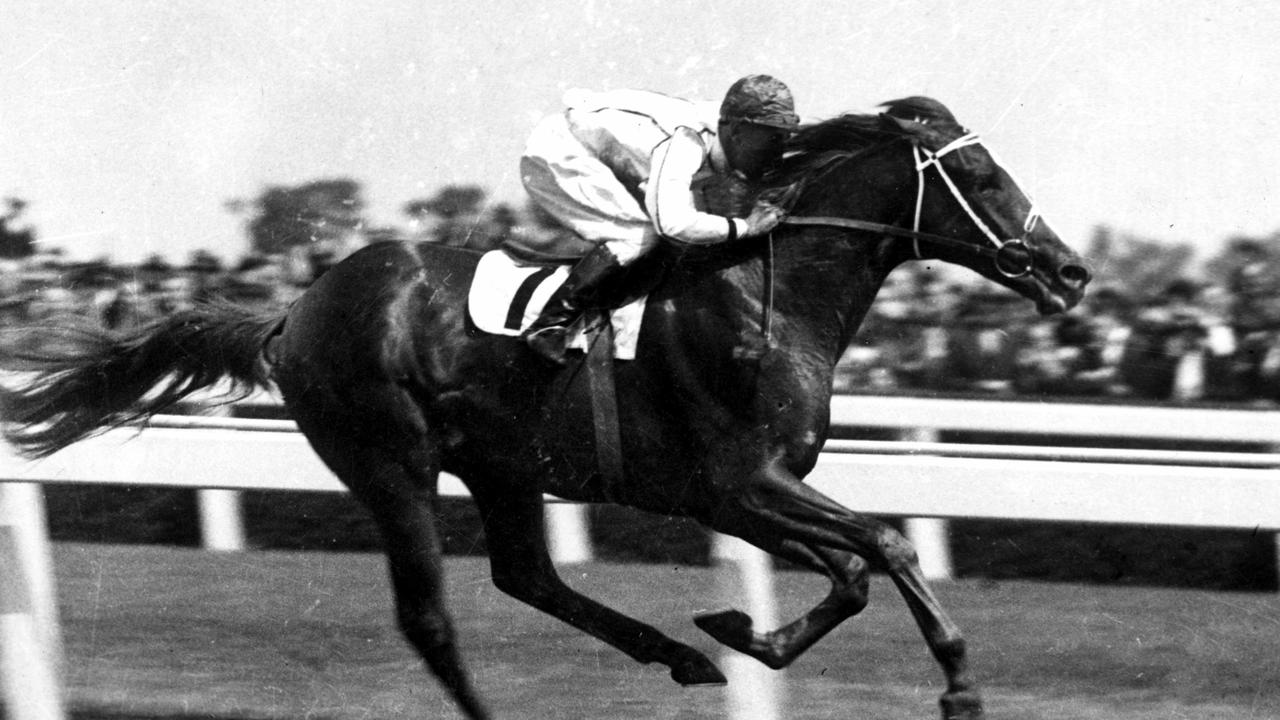 13/02/1937. Ajax, ridden by M. McCarten, doing it easily at the distance in the Federal Stakes at Williamstown. He won from Sweet Memories and Lochlee. racing. racehorse.
