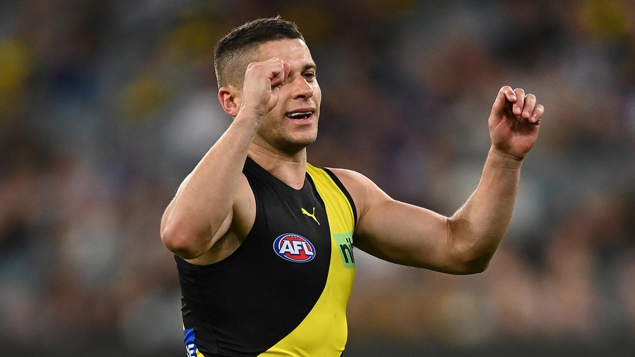 Dion Prestia of the Tigers celebrates kicking a goal.