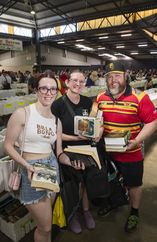 Adding to their library are (from left) Mackenna, Pennie and Clinton Shearer at The Chronicle Lifeline Bookfest at Toowoomba Showgrounds, Saturday, March 2, 2024. Picture: Kevin Farmer