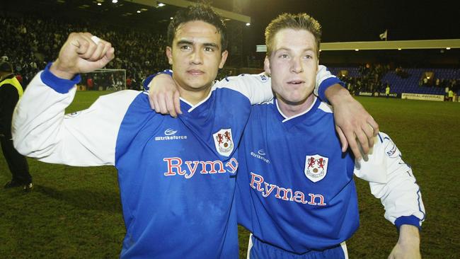 Tim Cahill with Neil Harris in 2004.