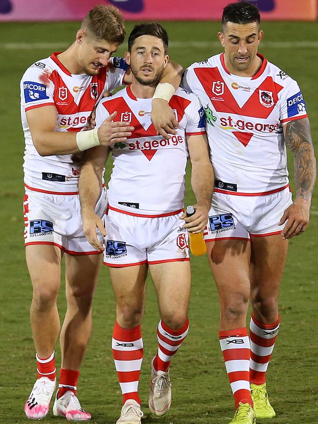 Dragons players Euan Aitken, Ben Hunt and Paul Vaughan celebrate a rare win this season. Picture: Jason McCawley/Getty Images