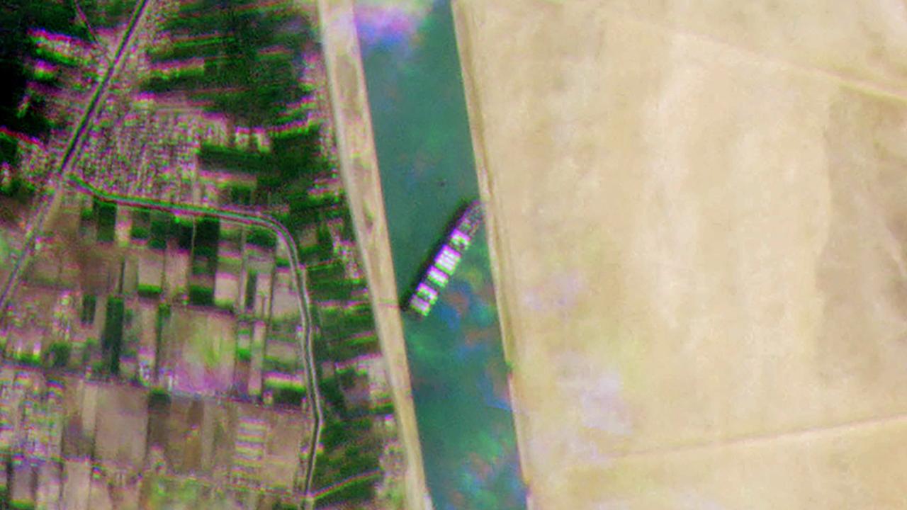 A satellite handout image shows the Taiwan-owned container ship lodged sideways and impeding all traffic across Egypt's Suez Canal. Picture: Planet Labs/AFP