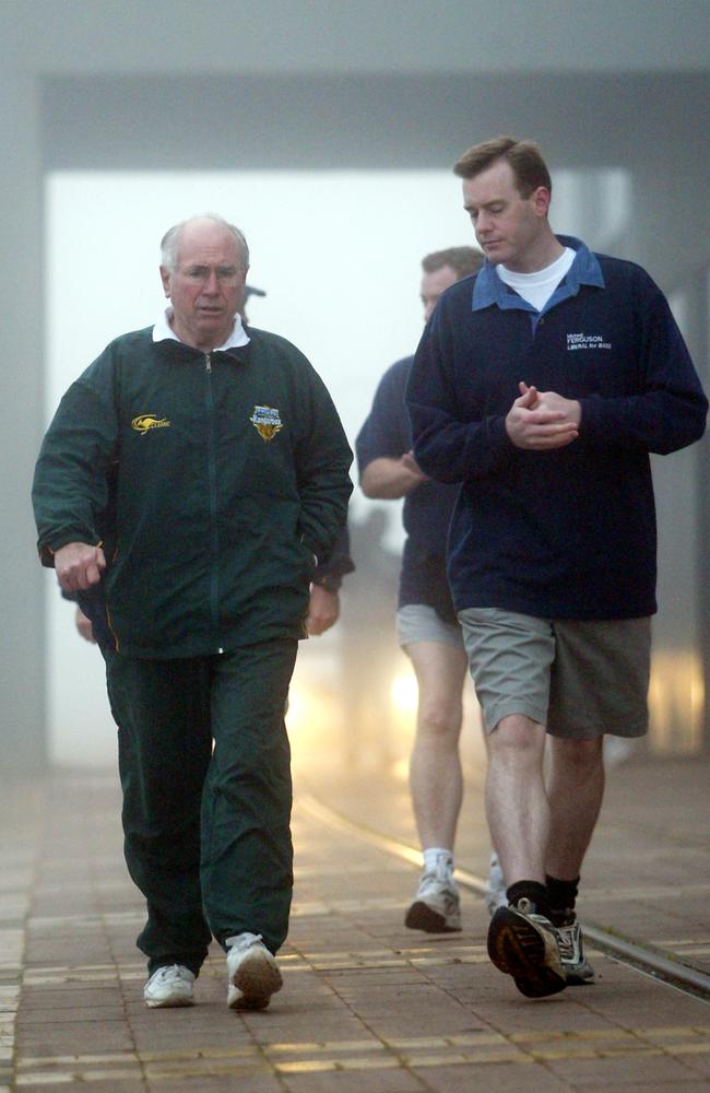 Prime Minister John Howard and then-Liberal Bass candidate Michael Ferguson during the morning walk at Launceston in 2004.