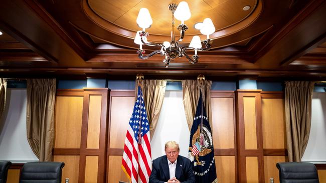 Donald Trump had Covid, he was regularly photographed working at the Walter Reed Medical Centre. (Photo by Tia DUFOUR / The White House / AFP)