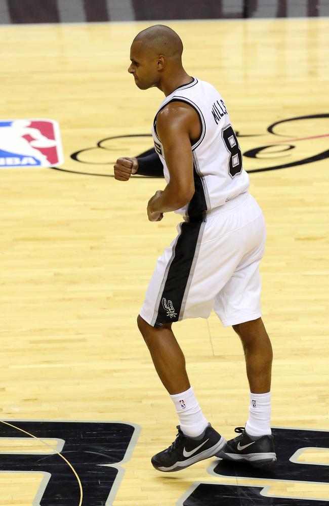 Patty Mills reacts after sinking a three for the San Antonio Spurs.