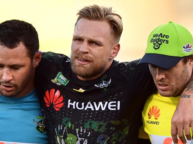 Raiders Blake Austin is carried off the field during the Round 10 NRL match between the Canberra Raiders and the Cronulla-Sutherland Sharks at GIO Stadium in Canberra, Sunday, May 13, 2018. (AAP Image/Mick Tsikas) NO ARCHIVING, EDITORIAL USE ONLY