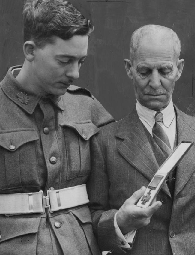 Osman Middleton (left), with his father Francis Middleton, view his brother Flt-Sgt Ron Middleton’s VC medal n 1943. The medal now sits in the Australian War Memorial.