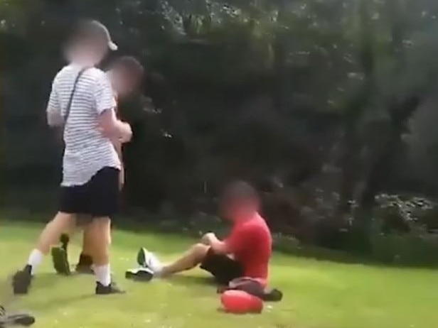 Still from a video showing the assault and robbery of a teenager by a Gold Coast high school student.