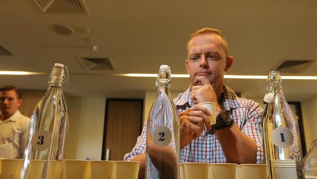 Troy Pettiford from the Whitsunday Shire Council ponders the samples. Picture Glenn Hampson