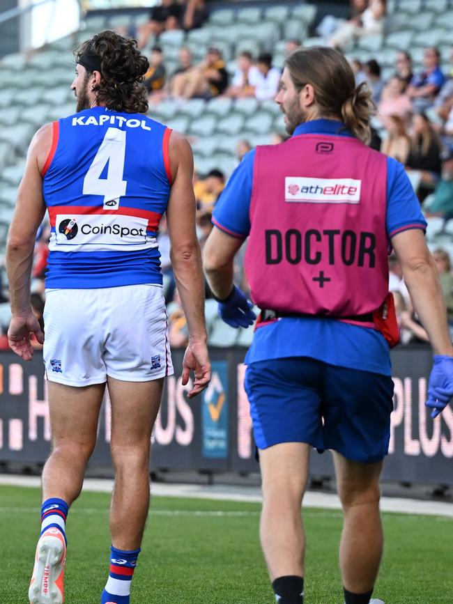 Bontempelli leaves the field injured during the AFL Community Series match against Hawthorn. (Photo by Steve Bell/Getty Images)