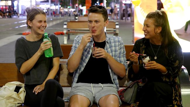 Friends Nikki Gustafson, Michael Parker and Alex Lipp would return to the CBD more often if there were more events on. Picture: Toby Zerna