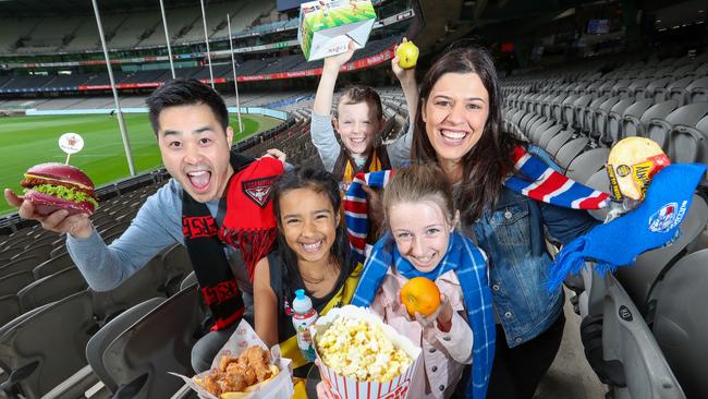 Footy fans taste test some of the stadium’s new menu options. Picture: Alex Coppel