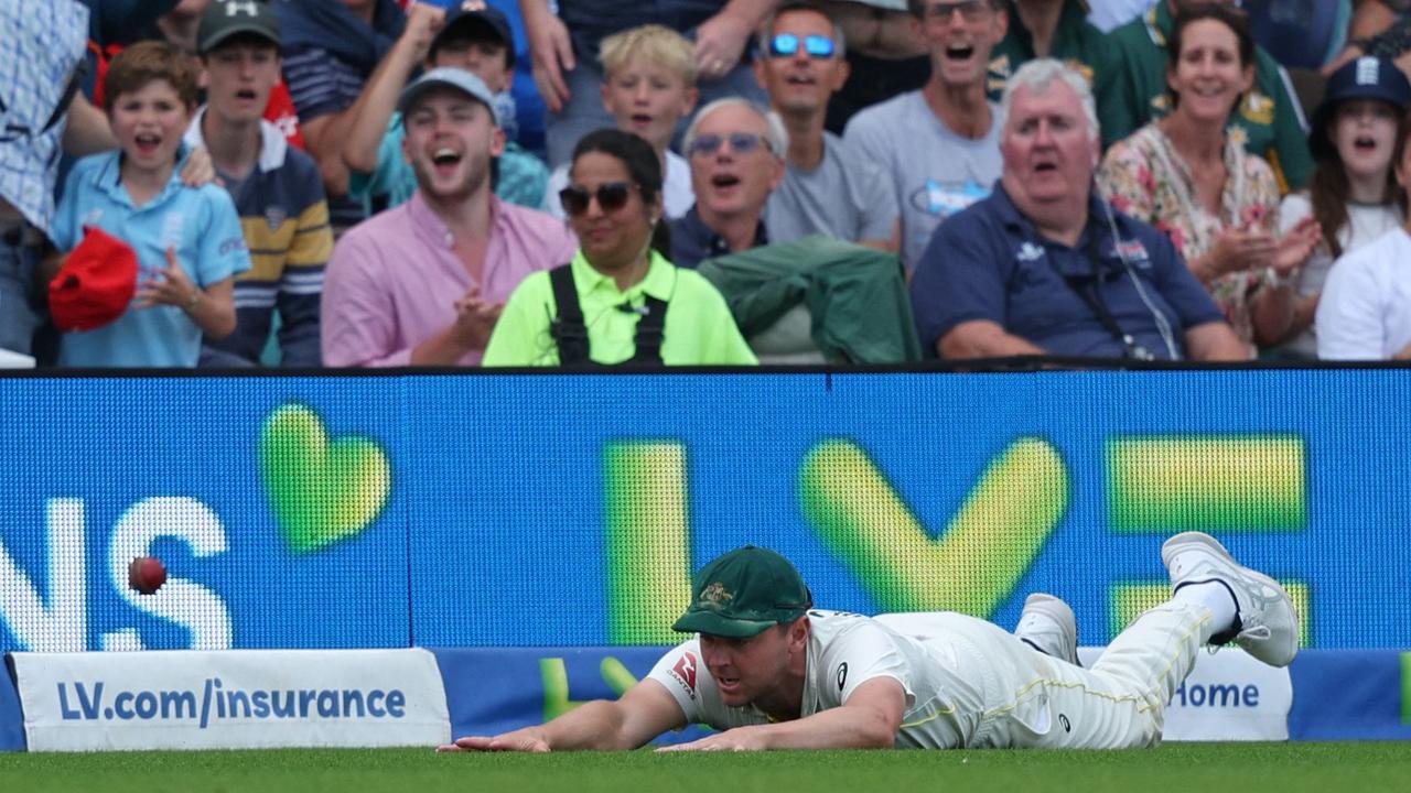 England fans cheer Josh Hazlewood misses the catch. (Photo by Adrian DENNIS / AFP)