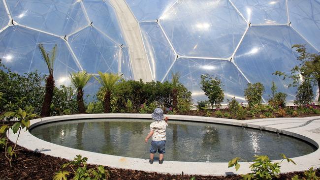 A toddler explores the Sense of Memory Garden at the Eden Project.